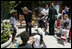 Mrs. Laura Bush talks with a little boy at Projecto Aprendiz Friday, March 9, 2007, in Sao Paulo, Brazil.