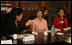 Mrs. Bush tips her teacup to Professor Chung Myung-wha during a discussion Saturday, Nov. 19, 2005, with women leaders in Busan, Korea.