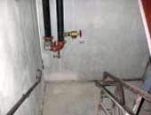 (Fig. 4.12) The feed for this standpipe was on a level above the fire department entry. The supply pipe was fed down (on the left) to the entry level, where the isolation valve was located. Then, the pipe was routed back upwards (on the right) to feed the standpipe riser.