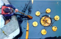 Tending an oil skimmer.