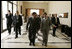 Laura Bush walks with King Abdullah II following a meeting at the Dead Sea in Jordan, Saturday, May 21, 2005.