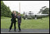 President George W. Bush and Laura Bush wave to the NCAA champions on the Truman balcony before departing the South Lawn en route Camp David Friday, May 13, 2005.