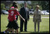 Mrs. Laura Bush and Mike Gottfried, CEO of Team Focus, watch Team Focus participants run a relay race Thursday, June 21, 2007, in Mobile, Ala., during a visit to Team Focus’ National Leadership Camp, as part of Helping America’s Youth initiative. Team Focus is a faith-based, nonprofit organization devoted to improving the lives of young men, ages 10-18, without fathers in their lives.