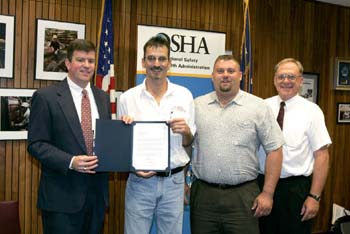 Jonathan L. Snare presents OSHA Challenge Completion Letter to Lee Clark, Shaun Marker, and Gary Bambauer of Garber Bros. Precision Concrete, Inc.