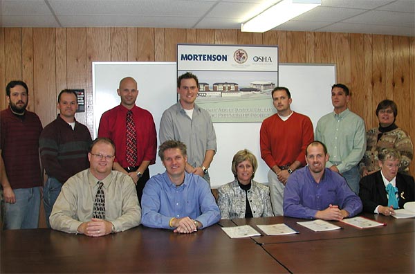 Top left: Adam Baird (Project Admin.), Gary Schneider (Superintendent), Josh Moore (OSHA Team Leader), Steve Eskildsen (Field Engineer), Michael Flinchum (Project Engineer), Jim Quinn (Safety Engineer), Julia Evans (OSHA Team Leader) Bottom Left: Troy Tilford (Project Manager), Larry Arndt (Construction Executive), Kathy O’Connell (Aurora OSHA Area Director), Paul Penzkover (Safety Director), Rita Mosley (Training Manager, Illinois Onsite Consultation)