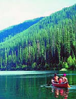Image of family canoeing on a lake.