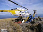 Scientist and helicopter at GPS site.
