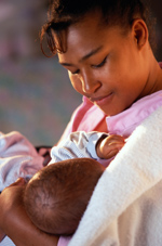 photo of woman breastfeeding baby