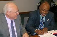 USADF President Lloyd Pierson signs grants agreements with Ambassador Charles Minor