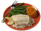 plate with fish, rice, green beans and a sweet potato