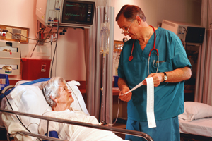 Doctor speaking with a patient in a hospital bed