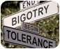 Road signs at the corner of bigotry and tolerance