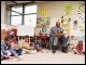 Secretary Paige with first grade students taking turns reading aloud at Skinner Magnet Center in Omaha, Nebraska, on March 24, 2003.