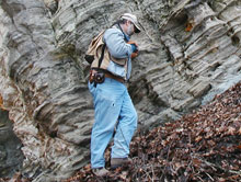 Missouri Geological Survey and Resource Assessment Division Geologist Chris Vierrether examines huge slump block of Ordovician age St. Peter Sandstone.