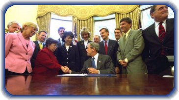 Picture of President George W. Bush on Thursday, August 1, 2002 signing the Nurse Reinvestment Act of 2002 in the Oval Office.