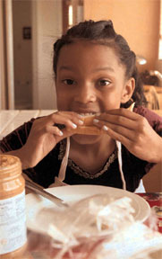 Photo of girl eating sandwich