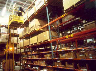 Photo of shelving in a warehouse.