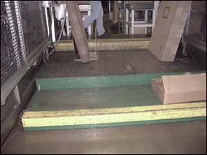 Open platforms that are built up in between thermoformers to get personnel up to a proper work height.