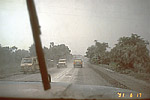 Vehicles on ash-covered road, Philippines