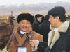 Radio Free Europe/Radio Liberty correspondent Danabek Binemov interviews a master falconer at an international falconry trial near Almaty, Kazakhstan.