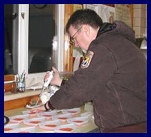 Photo of a scientist in a fish lab - Photo credit:  U.S. Fish and Wildlife Service