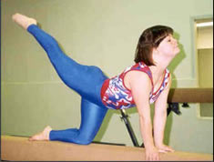 Image of Katy Wilson on gymnastics bar