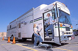 Psychologist and principal investigator welcomes seventh grader to mobile lab: Click here for full photo caption. 