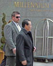A Diplomatic Security Special Agent, left, escorts North Korean Vice Foreign Minister Kim Kye-Gwan as he leaves his hotel in New York City, March 3, 2007. AP PHOTO.