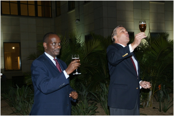 Ambassador Symington and Minister Dr. Richard Sezibera inviting the guests to enjoy the party