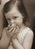 child eating an apple