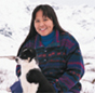 An Alaskan native with her dog.