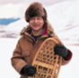 An Alaskan Native with his snowshoes.