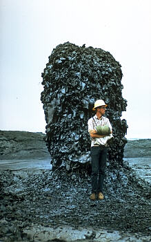 Hornito on pahoehoe flow with person for scale, Kilauea Volcano, Hawai`i