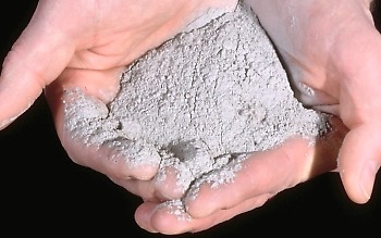 Photo: hands holding volcanic ash erupted by Mount St. Helens on May 18,1980