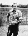 Bruce is holding the 1st crane chick (a greather sandhill) ever produced from frozen semen. 1978, Photo by George Gee, USGS