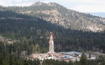 Photo of Long Valley Exploratory Well (LVEW) monitoring well with the drill rig in Long Valley caldera, California.