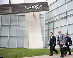 Secretary Michael Chertoff walks outside the Google Office Building