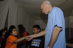 Secretary Michael Chertoff talks with a young lady at the Lindale Assembly Church in Houston, Sept. 17.