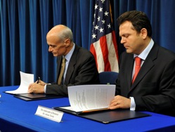 Department of Homeland Security Secretary Chertoff and Romanian Ambassador Adrian Vierita sign the Visa Waiver Program interim declaration on November 3, 2008 (DHS Photo/Cangemi.