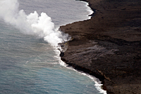 Lava enters the ocean at Waikupanaha creating a minor ocean entry plume due to a DI event that started yesterday morning.  The photo was taken during this morning's overflight when the tilt was at the bottom of the D phase.