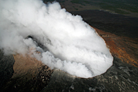 There have been no significant changes at Pu`u `Ō `ō for the last several weeks, and the crater remains obscured by heavy fume. Despite the thick fume, some vents within the crater can be roughly located by observing areas where the vigorous fuming rises above the general background level of fume, as can be seen in this photo. 