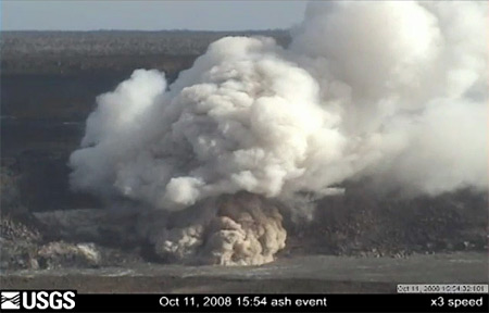 This Quicktime movie (x3 speed) shows an ash event from the vent in Halema`uma`u, occurring at 3:54 pm.  The normally white degassing plume is rapidly overwhelmed with a vigorous ash-rich pulse that rises rapidly from the vent.  Red flashes above the vent indicate hot, incandescent material being ejected.