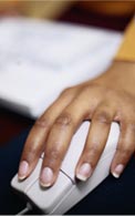 An Image of a Hand using a Computer Mouse.