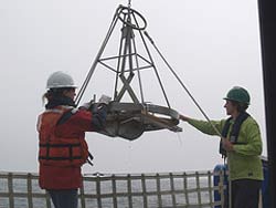 workers retriving sediment sample 