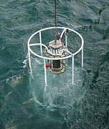 Photo of CTD instrument being deployed in the water
