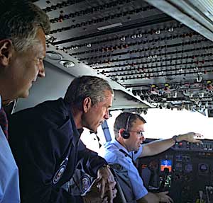 Aboard Air Force One with President Aleksander Kwasniewski of Poland, en route to Michigan, July 18.