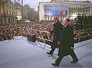 Approaching the podium with President Ion Iliescu of Romania to address citizens in Bucharest, November 23.