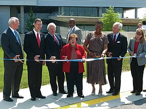 Photo showing the ribbon-cutting ceremony for the new NOAA Satellite Operations Facility in Suitland, MD.