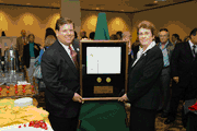 Public Printer Robert C. Tapella presents the Federal Depository Library of the Year Award to Betty Murr of the Middendorf-Kredell Branch of the St. Charles City-County Library District at a ceremony in Washington D.C. The library is located outside of St. Louis, MO.