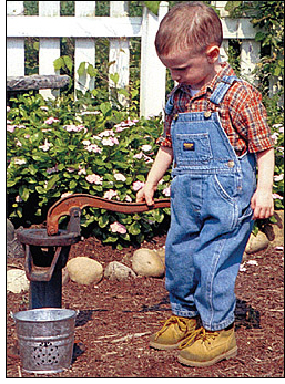 Cover Image of Boy Pumping Drinking Water Well